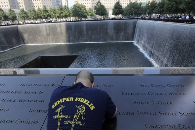 A man at the 9/11 Memorial on September 11, 2013